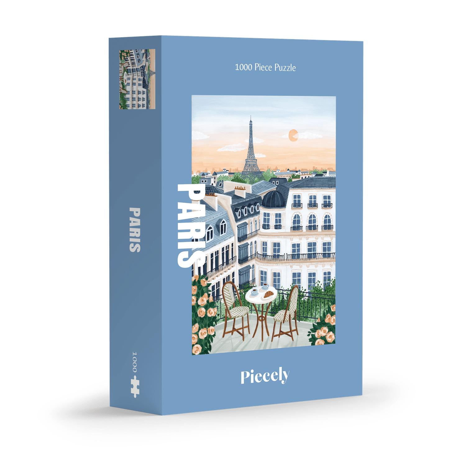1000-Teile-Puzzle „Paris“ von Piecely – Illustration eines Pariser Balkons mit Frühstückstisch und Blick auf den Eiffelturm, auf hellblauer Verpackung.