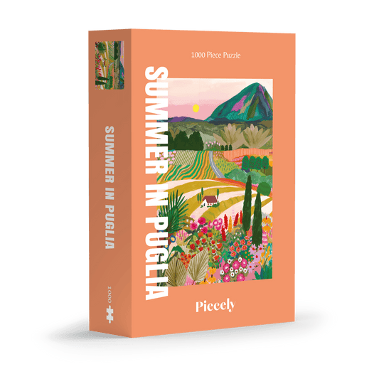 Außergewöhnliches 1000-Teile-Puzzle für Erwachsene, das die sommerliche Landschaft Apuliens in Italien zeigt. Zu sehen sind blühende Felder, Ein Berg und ein kleines Haus.