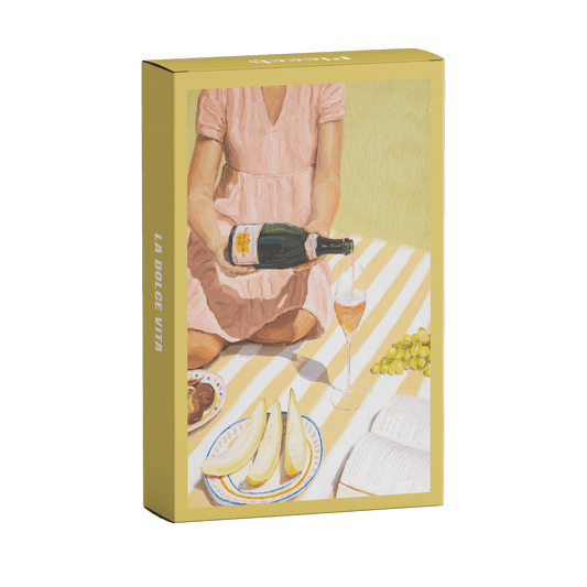 99-teiliges Minipuzzle für Erwachsene, das eine Frau beim Picknicken von Trauben, Feigen, Melone und Champagner zeigt. 