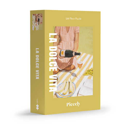 500-teiliges Puzzle für Erwachsene, das eine Frau beim Picknicken von Trauben, Feigen, Melone und Champagner zeigt. 