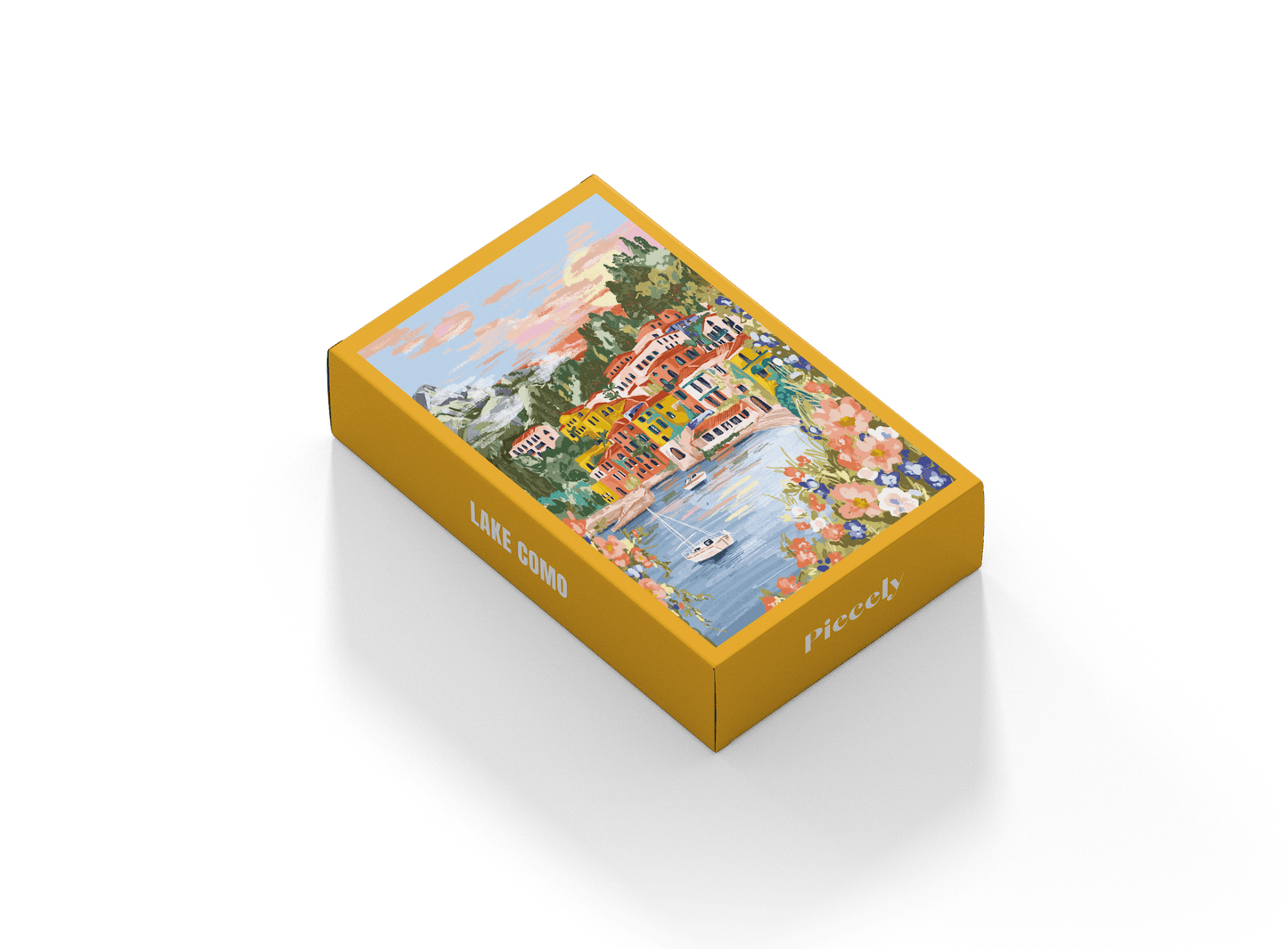 99-teiliges Minipuzzle für Erwachsene, das den Comer See in Varenna zeigt. In der Bucht befinden sich zwei Boote und die Sicht auf den See ist gesäumt von bunten Häusern.