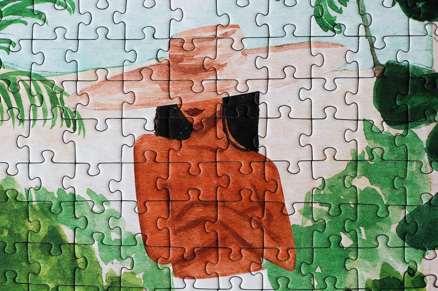 Außergewöhnliches Puzzle für Erwachsene mit einer Illustration von einer Frau in Marokko umgeben von Meer, tropischen Pflanzen und Zitronen.